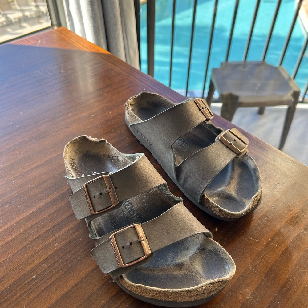 Well loved olive green Birkenstock sandals